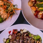 Three flavorful dishes featuring seafood and avocado, plated creatively for a delightful meal.